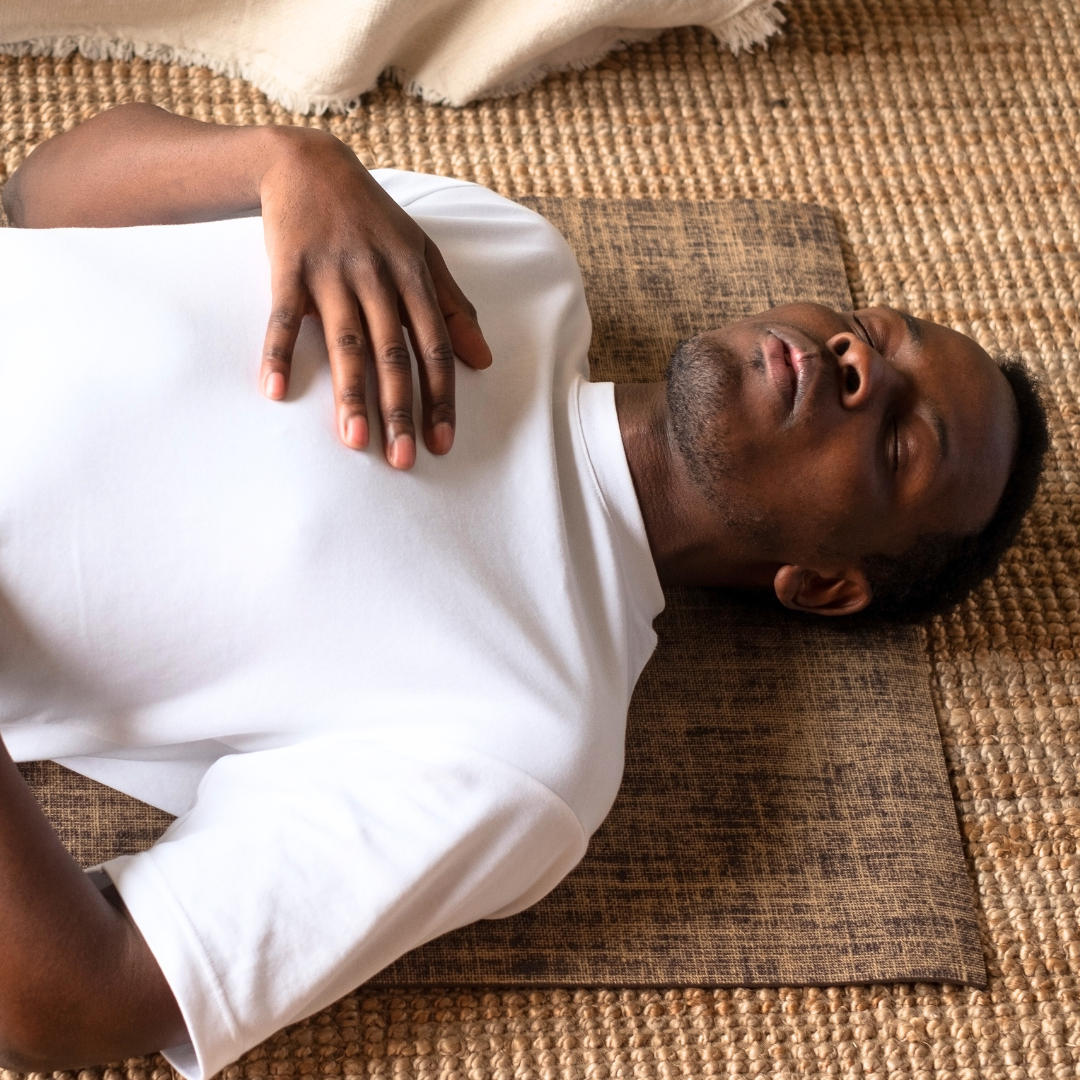 person-on-floor-hand-on-heart